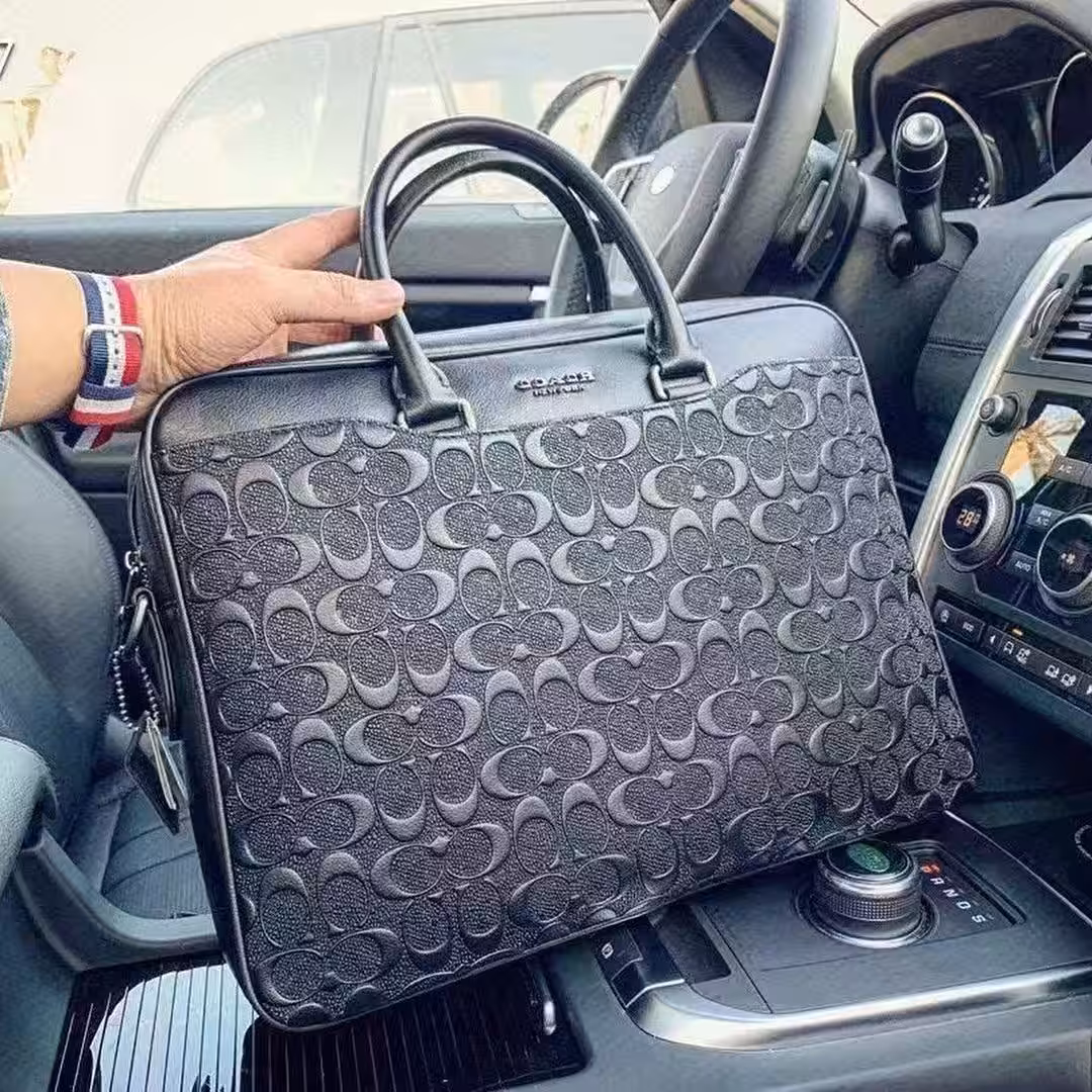 WhatsApp Image 2025-12-18 at 10.21.42 PM Coach Embossed Premium Laptop Bag