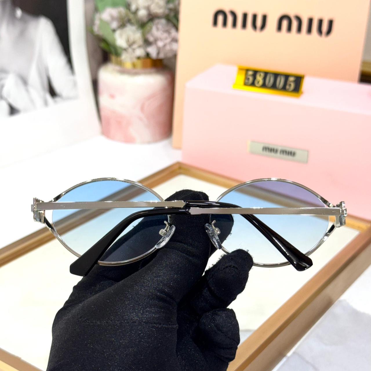 Miu Miu Round Metal Silver Frame with Blue Women’s Sunglasses