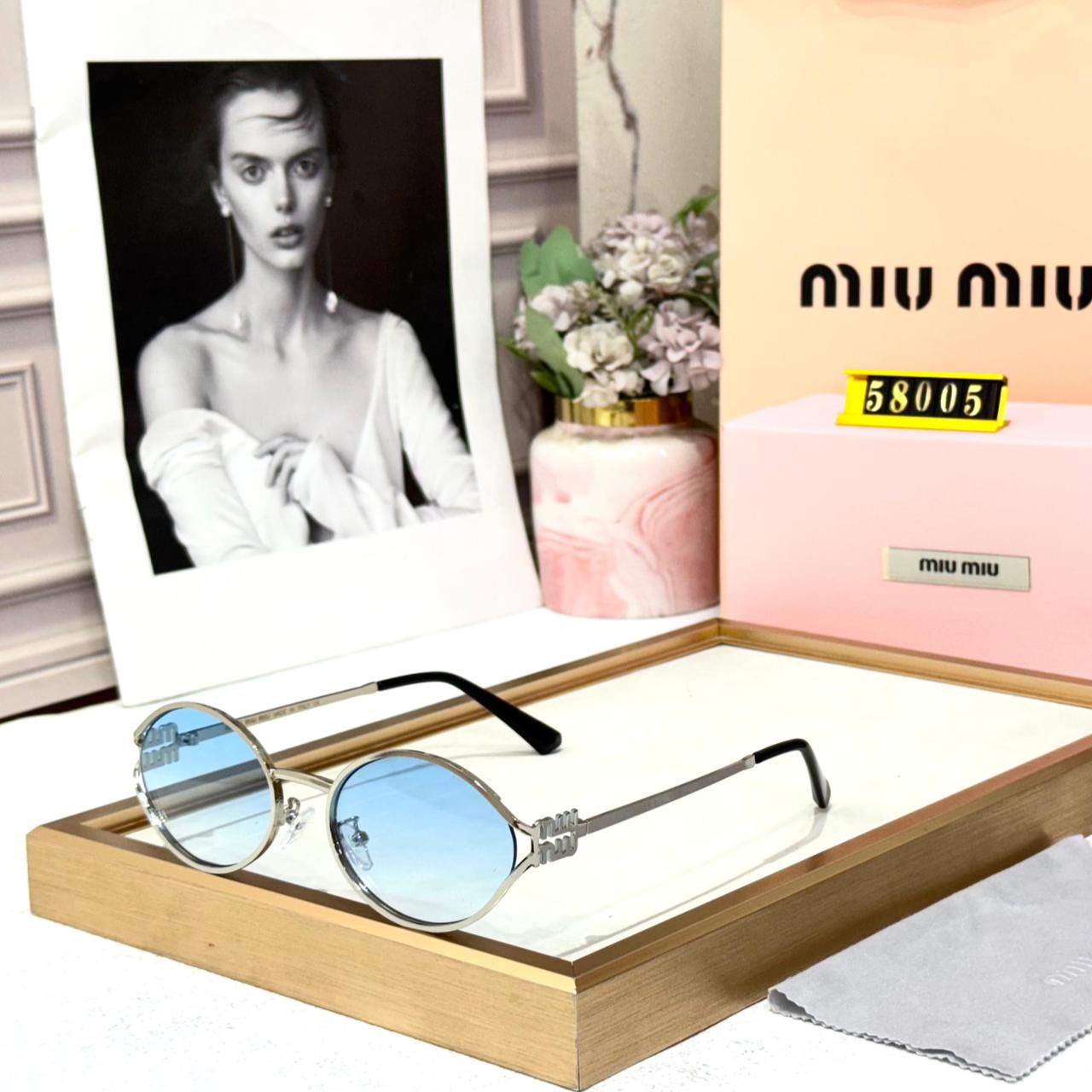 Miu Miu Round Metal Silver Frame with Blue Women’s Sunglasses